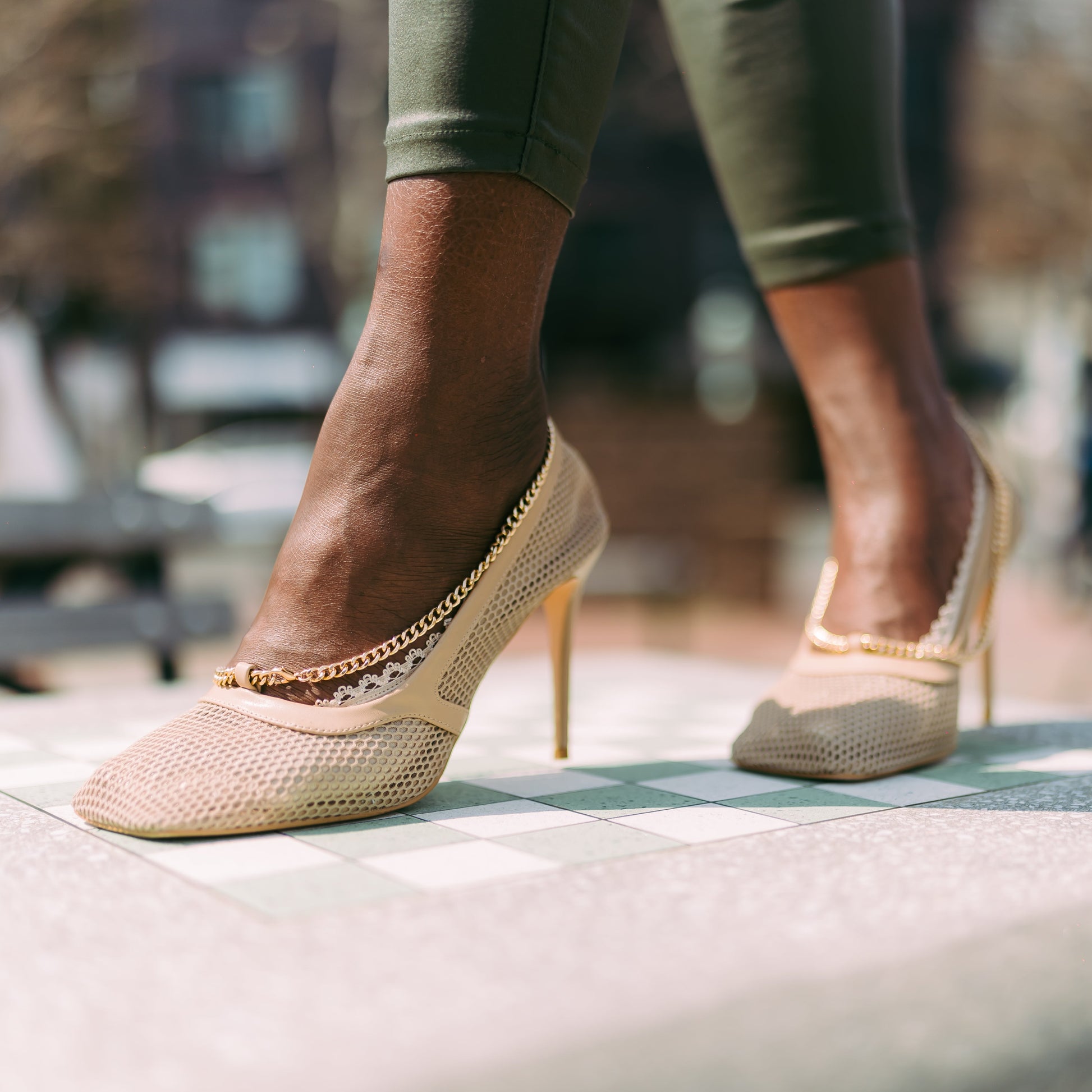 African American woman wearing sand nude footies with trendy webbed netting shoes - stylish night out look