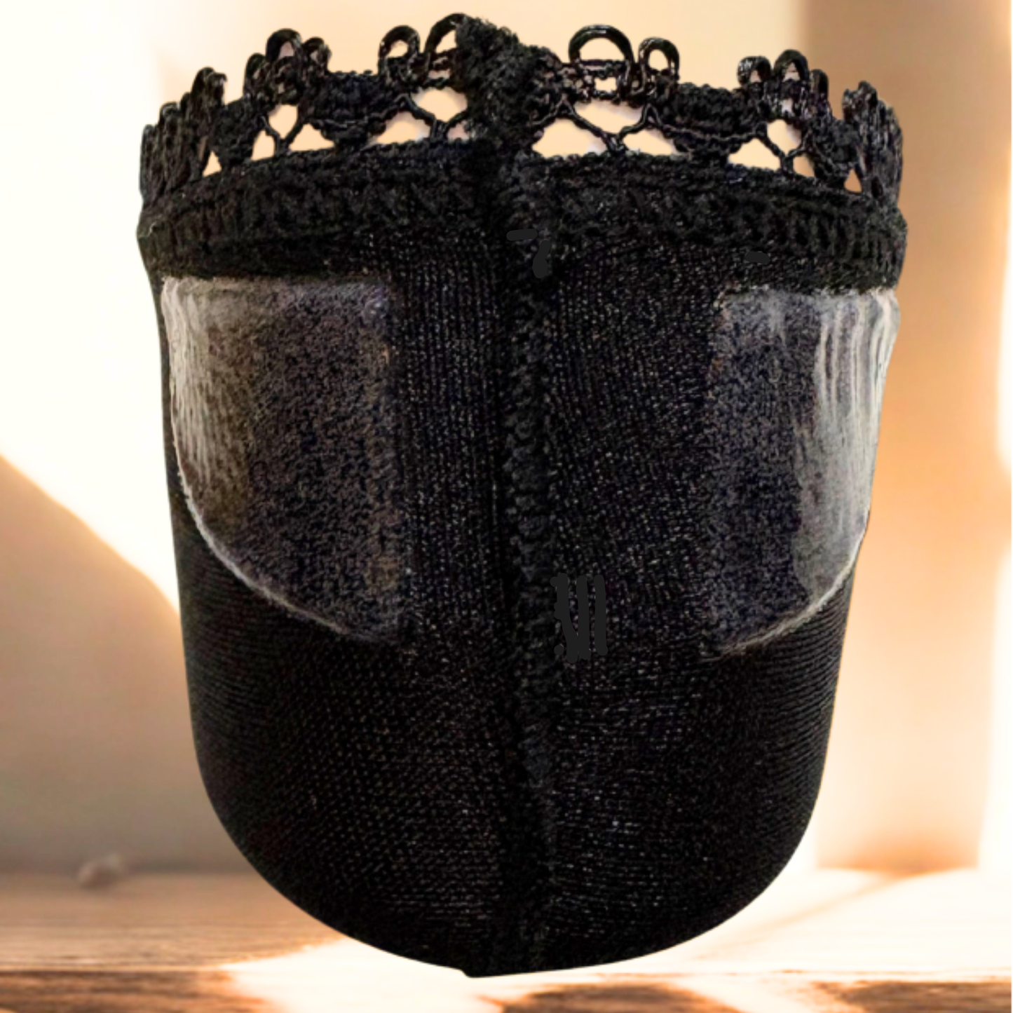 Close-up of black Arnacci no-show sock showing double silicone heel grips and lace trim for non-slip, all-day hold in heels and flats.