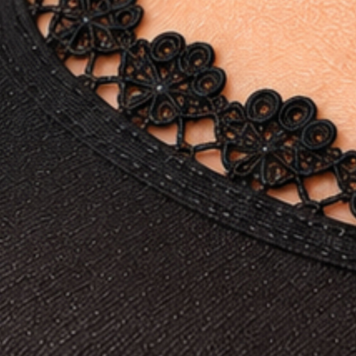 Close-up of Arnacci women's black no-show footie socks featuring smooth nylon-spandex fabric, subtle shimmer, and delicate lace edging.