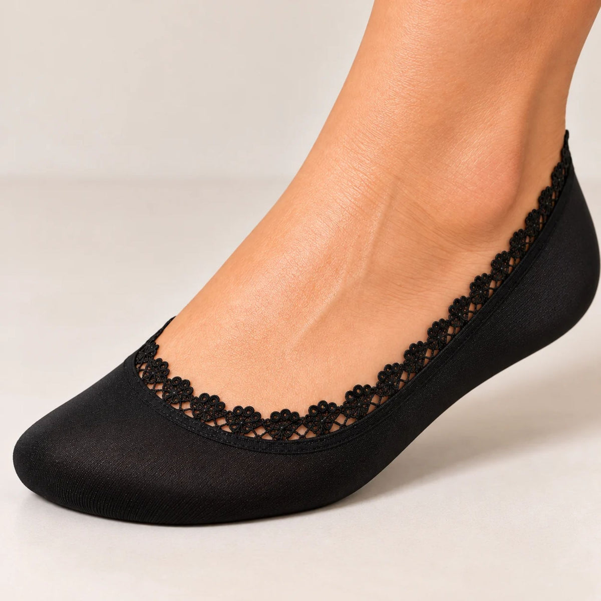 Arnacci women's lace-trimmed footie sock with extra foot coverage designed to help reduce rubbing from shoes.