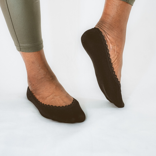 Black no-show footies by Arbella Style on African American woman - invisible socks for all skin tones