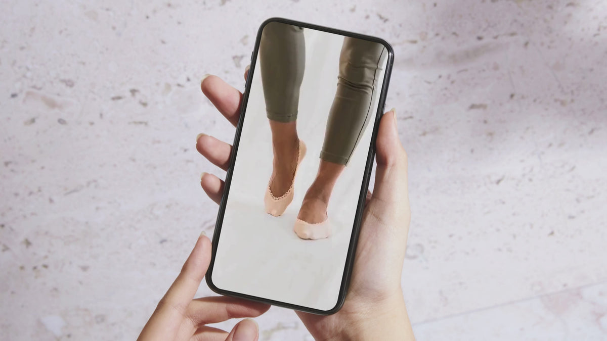 Load video: See Arnacci no-show socks for women from multiple angles, highlighting the silky, semi-sheer fabric, delicate picot lace trim, higher coverage, and chic look with heels.