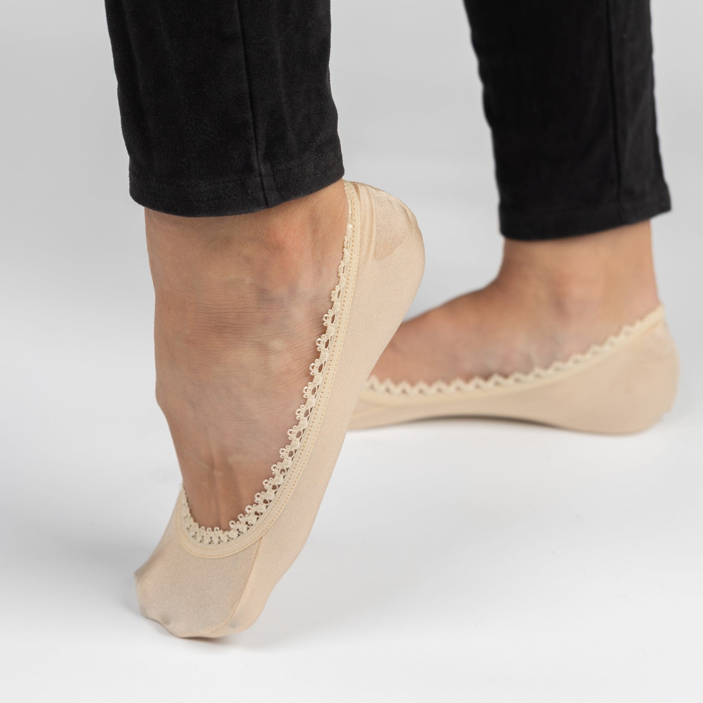 White woman wearing nude heels with jeans and sand footies - Arbella Style casual look