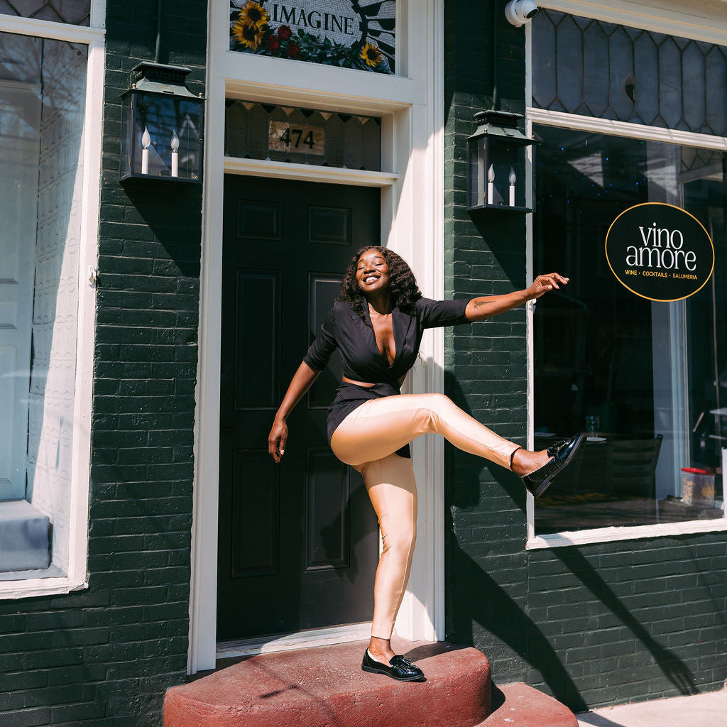 Woman kicking leg up showing Arbella Style stay-put footies - no-show socks stay in place