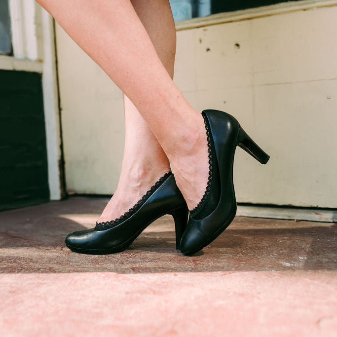Woman modeling black heels with black footies - Arbella Style professional office wear